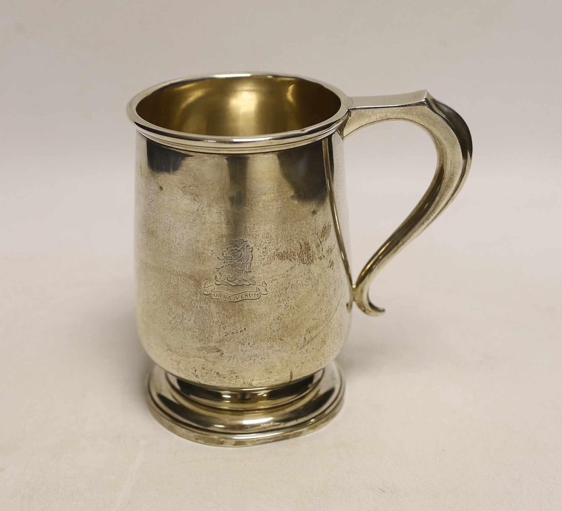 A George V silver mug, with engraved armorial, A & J Zimmerman, Birmingham, 1930, 13cm, 9oz.
